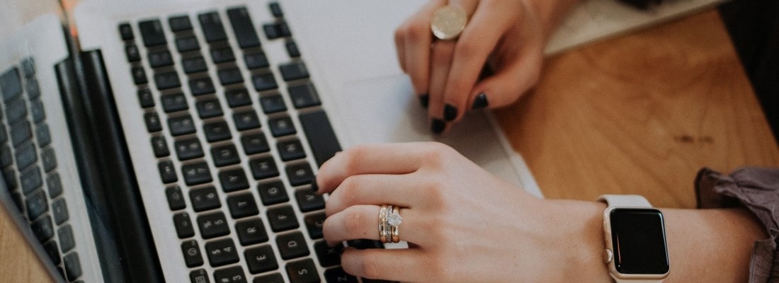 Woman typing on a laptop