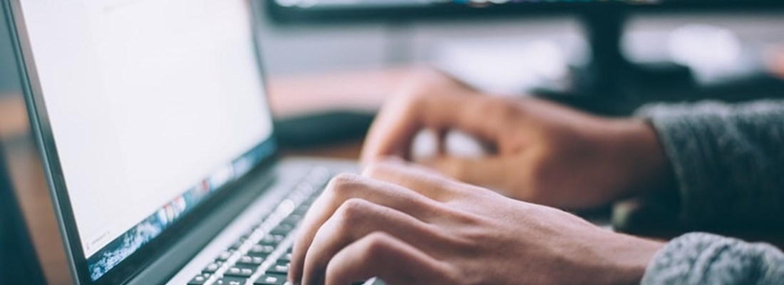 Person typing on a laptop