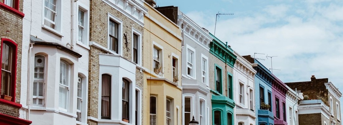 Row of painted coloured houses in the UK