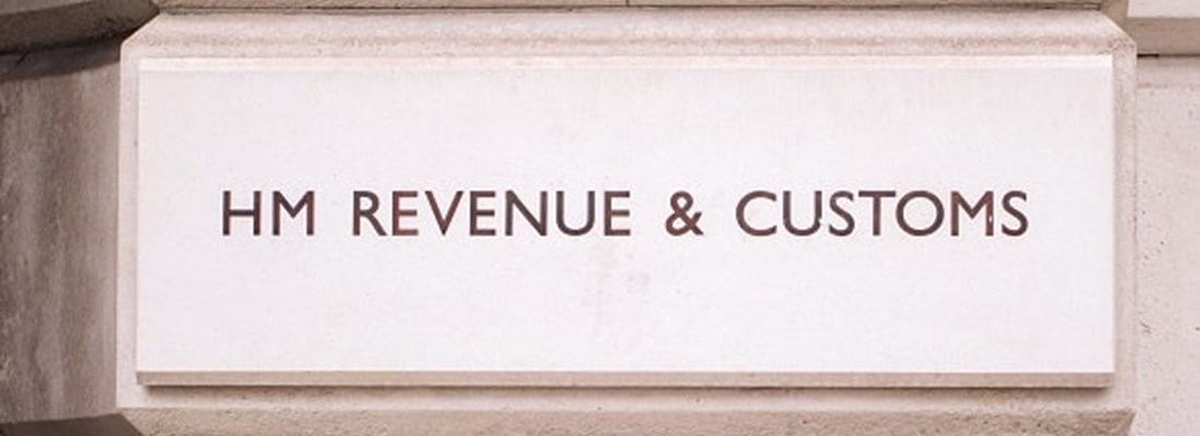 HM Revenue & Customs logo on a building.