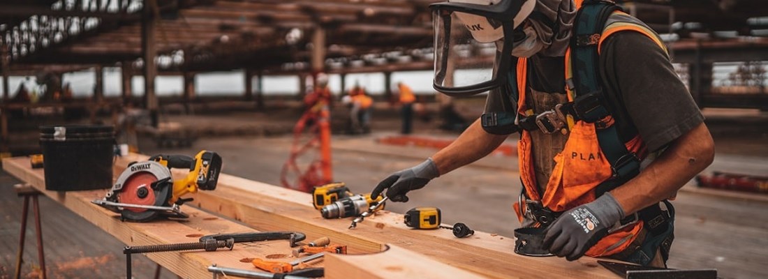 Factory worker will tools and in high-vis