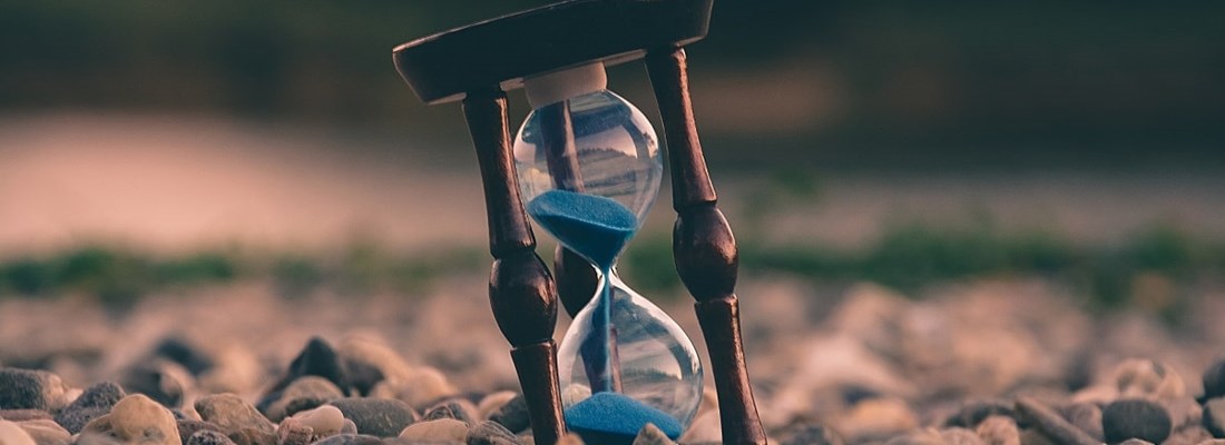 Hourglass on a beach.