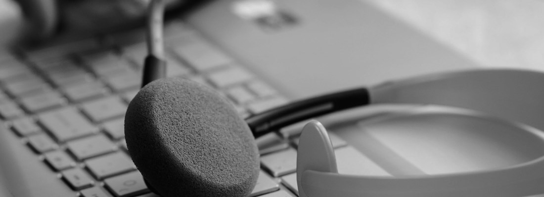 Headphones resting on a keyboard.