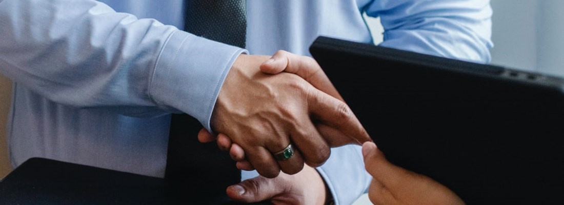 Two people shaking hands.