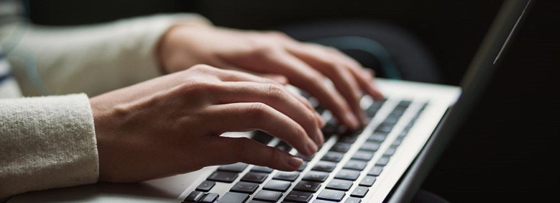 Person typing on a laptop