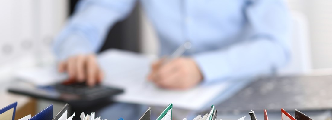 person working with paper files