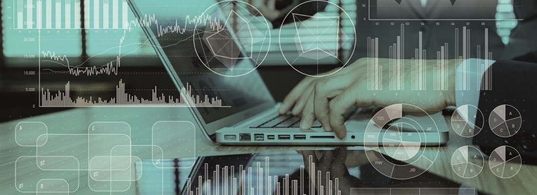 Two people working on a laptop with overlaid financial graphs, charts, and data visualisations