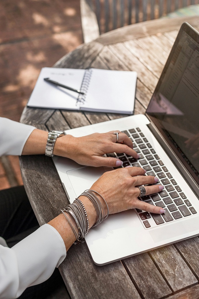 Person typing on laptop